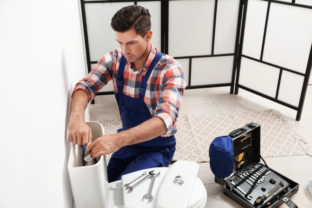 Plumber Fixing Slow Filling Toilet