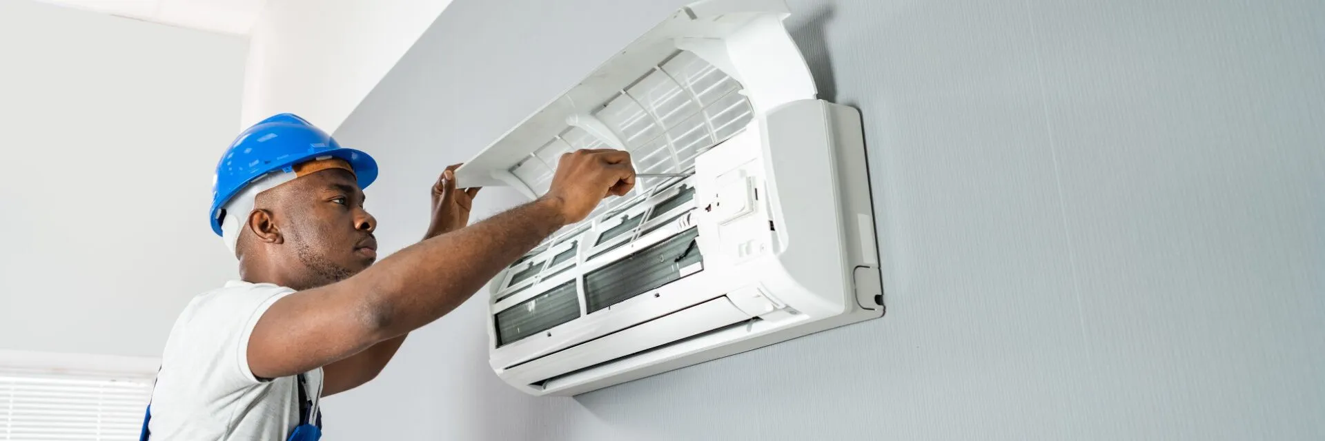 Blue-Collars-HVAC-Technician-working-on-Mini-Split