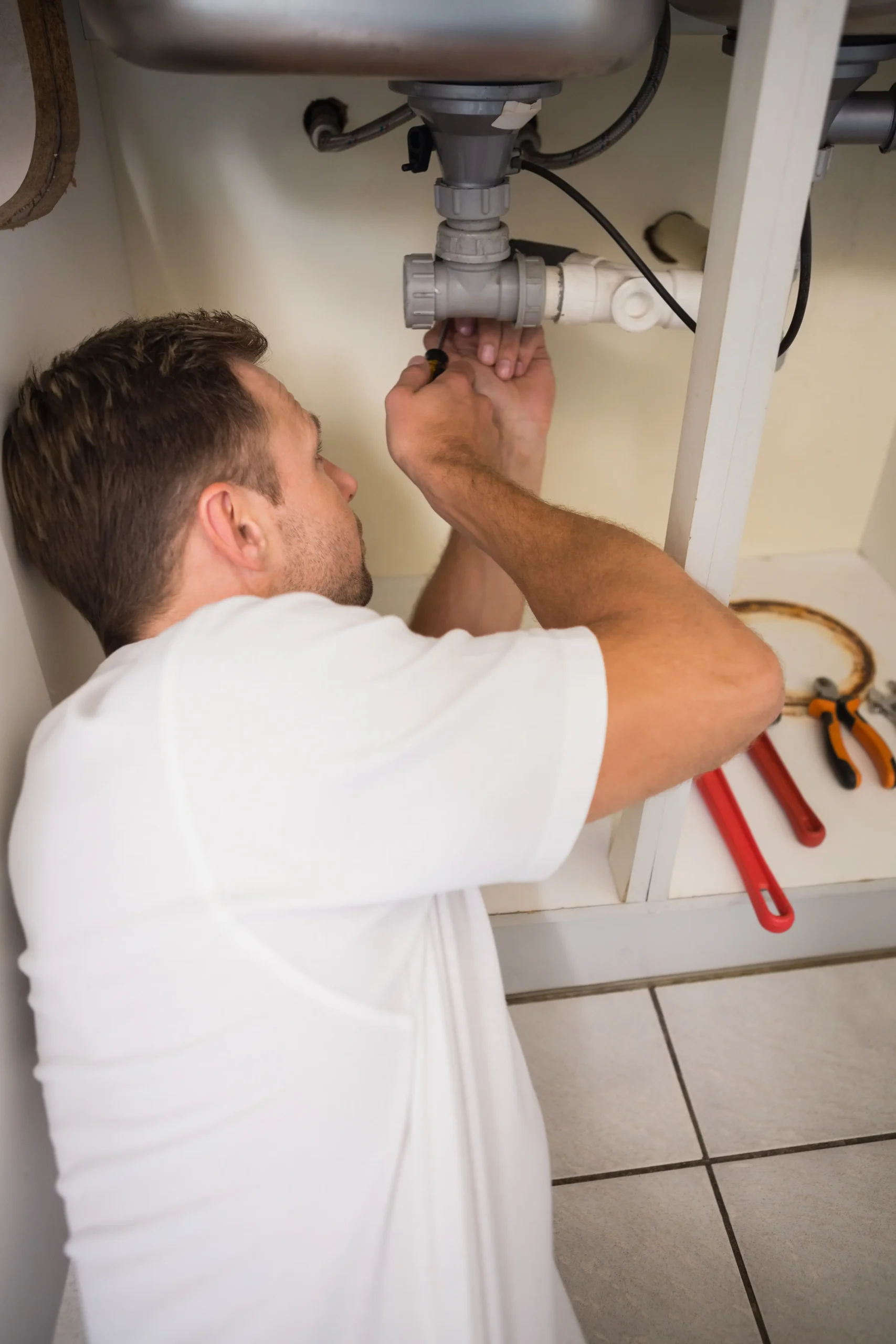 plumber-fixing-sink